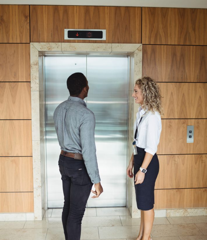 Business executive waiting for lift in office
